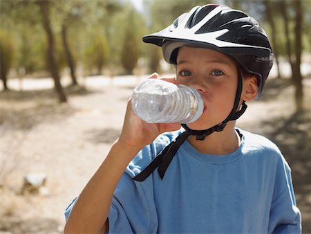 Boy drinking water Stock Photo - Premium Royalty-Free, Code: 614-01180147