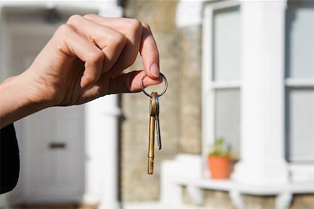 exterior bay window photos - Person with keys to house Stock Photo - Premium Royalty-Free, Code: 614-01219484