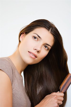 simsearch:614-06897917,k - Woman brushing hair Stock Photo - Premium Royalty-Free, Code: 614-01219616