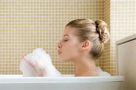 Woman bathing Stock Photo - Premium Royalty-Free, Code: 614-01219613