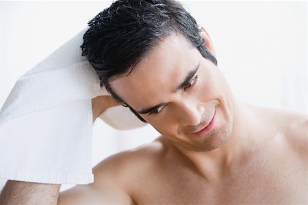Man drying his hair Stock Photo - Premium Royalty-Free, Code: 614-01237198