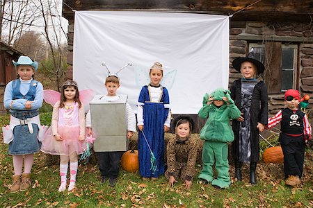 farmhouse with animals - Kids in halloween costumes Stock Photo - Premium Royalty-Free, Code: 614-01238183