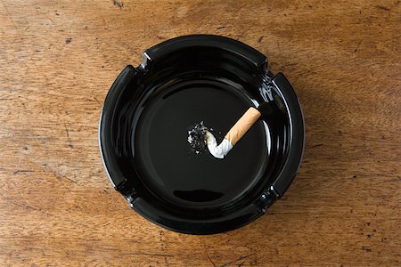 Cigarette butt in an ashtray Stock Photo - Premium Royalty-Free, Code: 614-01238770