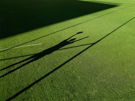 rugby - Shadow of rugby player and rugby post Foto de stock - Sin royalties Premium, Código: 614-01435480