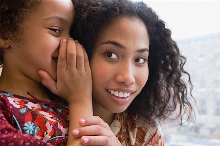 Daughter whispering to mother Stock Photo - Premium Royalty-Free, Code: 614-01558940