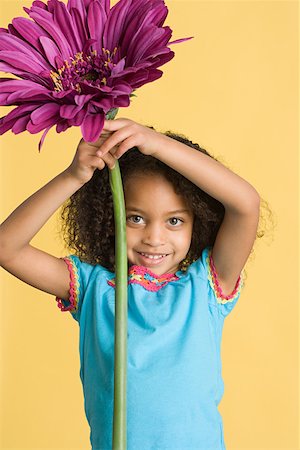 fake flowers - Girl with a big flower Stock Photo - Premium Royalty-Free, Code: 614-01559164