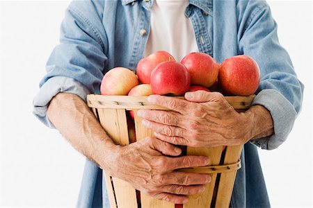 simsearch:614-02241707,k - Man holding basket of apples Foto de stock - Sin royalties Premium, Código: 614-01560848