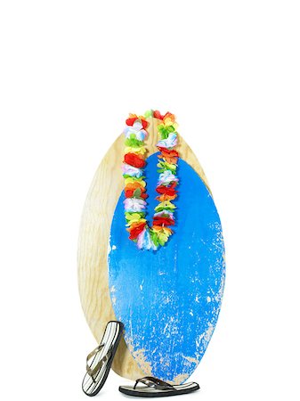 Surfboard flipflops and a garland of flowers Stock Photo - Premium Royalty-Free, Code: 614-01561295