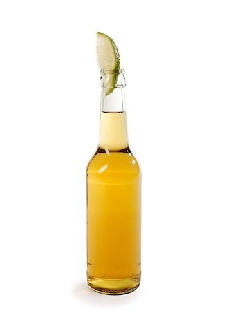 simsearch:614-02639876,k - Bottle of lager and slice of lime Stock Photo - Premium Royalty-Free, Code: 614-01561299