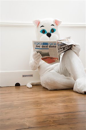 people reading in funny - Person in cat costume reading newspaper Stock Photo - Premium Royalty-Free, Code: 614-01626241