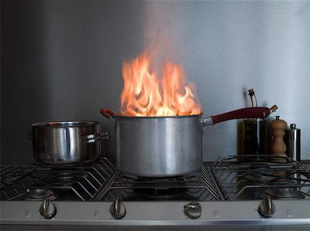 dangerous kitchen - A saucepan on fire Stock Photo - Premium Royalty-Free, Code: 614-01623466