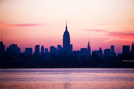 simsearch:614-02611760,k - Manhattan skyline at sunset Foto de stock - Sin royalties Premium, Código: 614-01703031