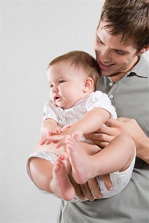 Portrait of a father and his baby daughter Stock Photo - Premium Royalty-Free, Code: 614-01758393