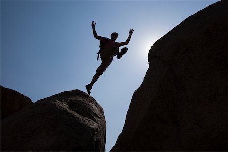 rock jump - Man jumping chasm Stock Photo - Premium Royalty-Free, Code: 614-01819600