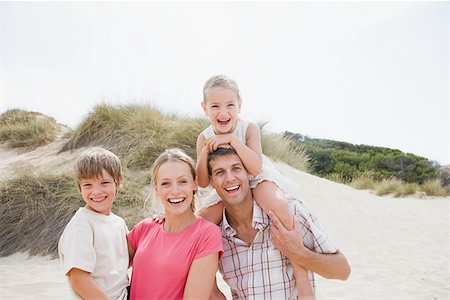 shoulder carry - Happy family at beach Stock Photo - Premium Royalty-Free, Code: 614-01819950