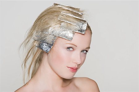 foil highlights - A woman having her hair highlighted Stock Photo - Premium Royalty-Free, Code: 614-01820033