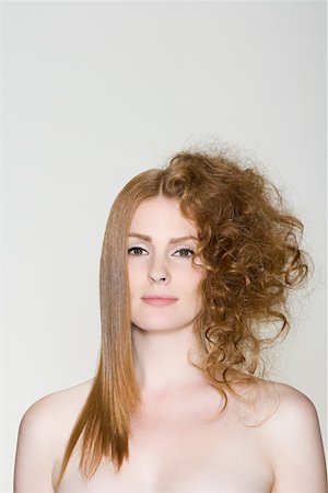 A woman with straight and curly hair Stock Photo - Premium Royalty-Free, Code: 614-01820064