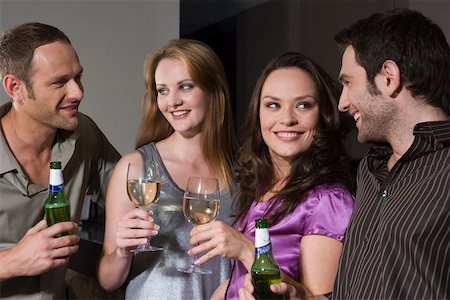 Couples flirting in a bar Stock Photo - Premium Royalty-Free, Code: 614-01820726