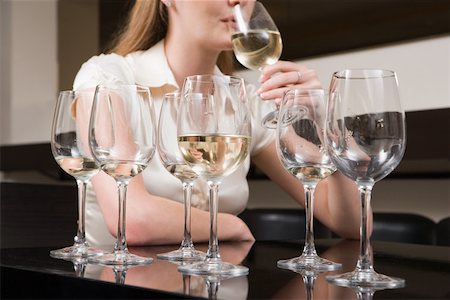 drucken - Woman binge drinking wine Stock Photo - Premium Royalty-Free, Code: 614-01820721