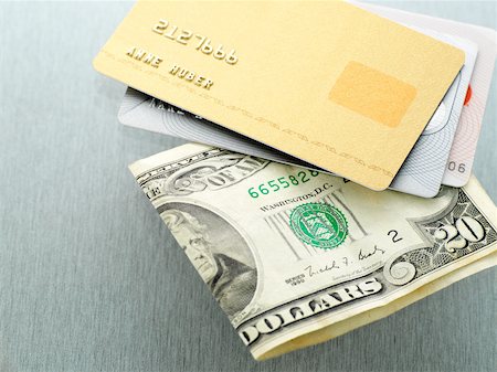 Money and credit cards Stock Photo - Premium Royalty-Free, Code: 614-01868922