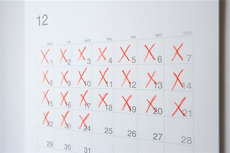 Dates crossed of on a calendar Stock Photo - Premium Royalty-Free, Code: 614-01869603