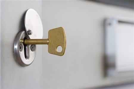 A key in a lock Foto de stock - Sin royalties Premium, Código: 614-01869624