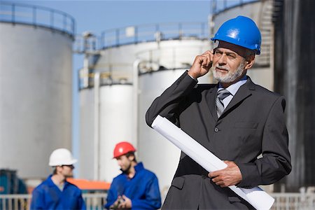 engineer on phone - Engineer on cellphone Stock Photo - Premium Royalty-Free, Code: 614-02004756