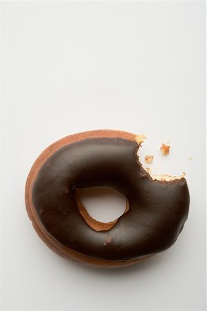 simsearch:614-03191356,k - Doughnut with missing bite Stock Photo - Premium Royalty-Free, Code: 614-02048585