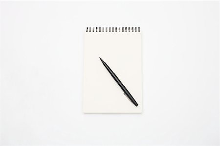 Notepad and pen Stock Photo - Premium Royalty-Free, Code: 614-02049270