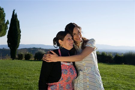 family italy - Mother and daughter hugging in a field Stock Photo - Premium Royalty-Free, Code: 614-02049349