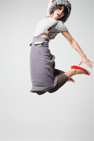 Japanese woman jumping Stock Photo - Premium Royalty-Free, Code: 614-02049478