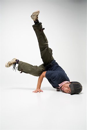 Young man breakdancing Stock Photo - Premium Royalty-Free, Code: 614-02049518