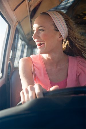 A young woman driving a camper van Stock Photo - Premium Royalty-Free, Code: 614-02049726