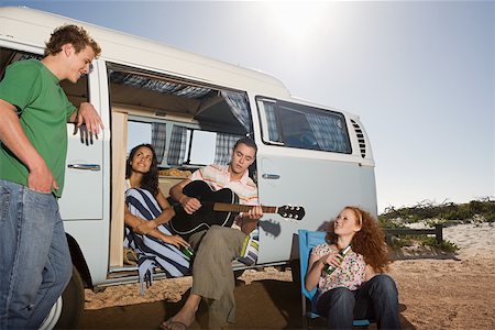 Friends on the beach with a camper van Stock Photo - Premium Royalty-Free, Code: 614-02049729