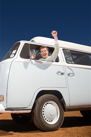A young man driving a camper van Stock Photo - Premium Royalty-Free, Code: 614-02049798