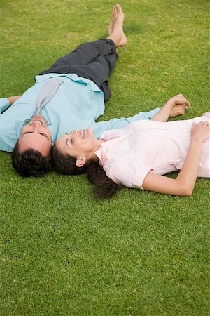 Couple lying on grass Stock Photo - Premium Royalty-Free, Code: 614-02049871