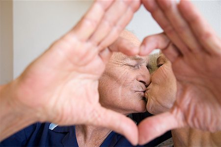 senior woman inspirational - A senior couple kissing Stock Photo - Premium Royalty-Free, Code: 614-02049904