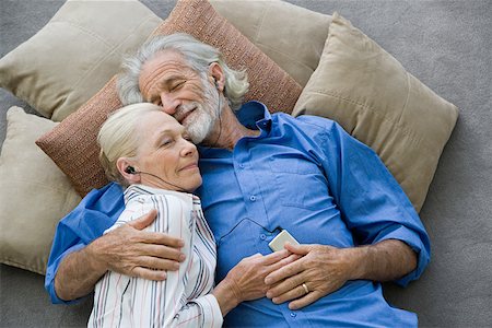 floor cushion - Senior couple with mp3 player Stock Photo - Premium Royalty-Free, Code: 614-02050034
