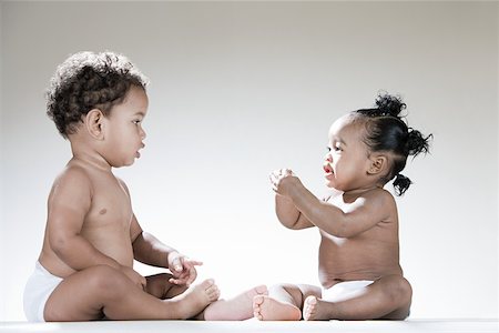 A baby boy and baby girl Stock Photo - Premium Royalty-Free, Code: 614-02050167