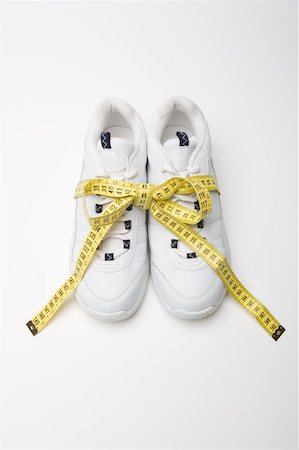 sneaker not people - Trainers and a tape measure Stock Photo - Premium Royalty-Free, Code: 614-02050688
