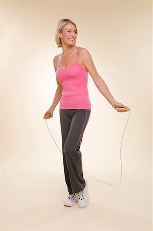 skipping - A woman skipping Stock Photo - Premium Royalty-Free, Code: 614-02050733