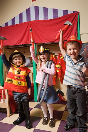 firefighter and kid - Children pretending to be firefighters Stock Photo - Premium Royalty-Free, Code: 614-02051075