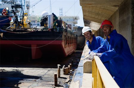 ship yard - Portrait of two harbour workers Stock Photo - Premium Royalty-Free, Code: 614-02074019