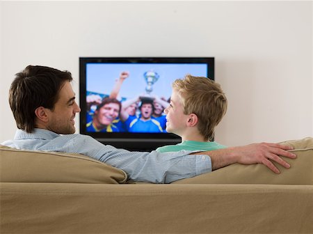 family home tv caucasian - Father and son watching a football match Stock Photo - Premium Royalty-Free, Code: 614-02074933