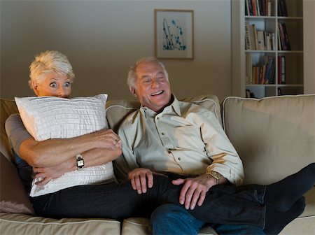 A senior couple watching tv Stock Photo - Premium Royalty-Free, Code: 614-02074970