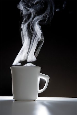 steaming coffee mug - Hot drink with steam Stock Photo - Premium Royalty-Free, Code: 614-02073146