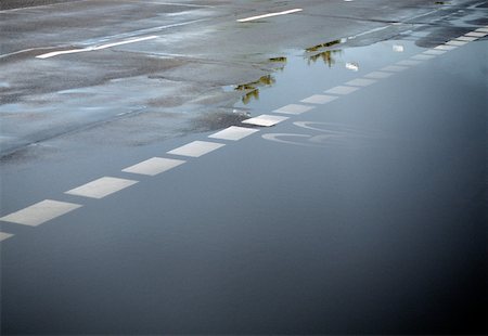 puddle road - Flooded road Stock Photo - Premium Royalty-Free, Code: 614-02073394