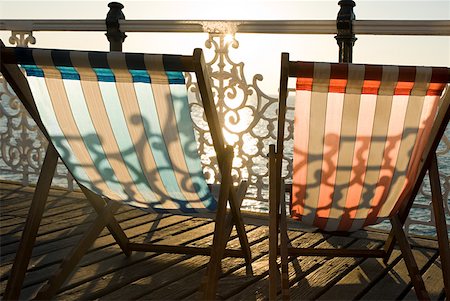deck chair railing - Deckchairs by the sea Stock Photo - Premium Royalty-Free, Code: 614-02073461