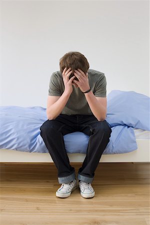 sad picture of a teenage boy alone - A teenage boy crying Stock Photo - Premium Royalty-Free, Code: 614-02244158