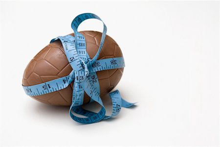 A tape measure tied round an easter egg Stock Photo - Premium Royalty-Free, Code: 614-02240362